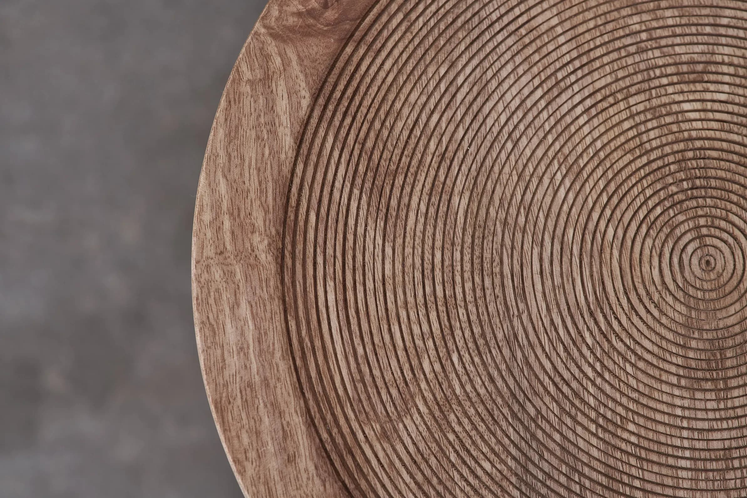Close-up of a hand-carved wooden tray